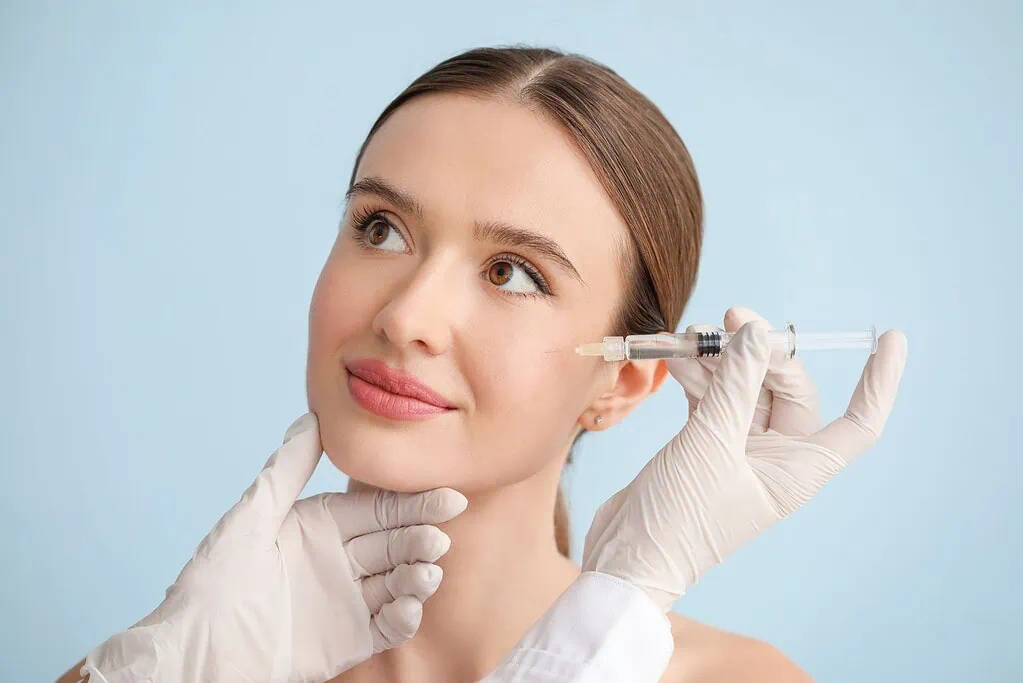 Woman receiving anti-wrinkle facial injection